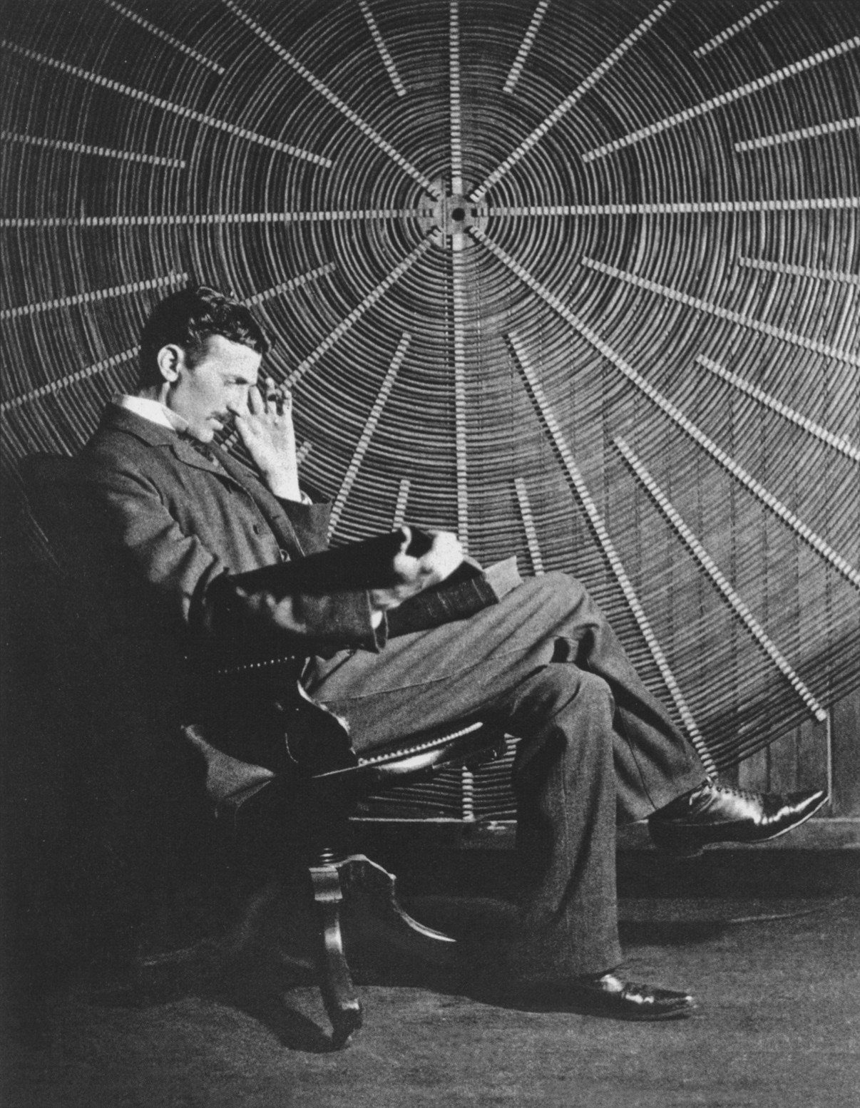 Nikola Tesla (1856-1943) thinking